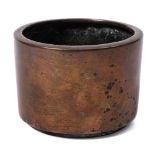 A Chinese bronze censer: of plain cylindrical form with flattened rolled rim, Qing Dynasty,