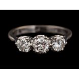 A diamond three stone ring,: set with three brilliant cut diamonds, approximately 1.
