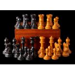 A boxwood and ebony Staunton pattern chess set: with weighted bases, the king 8cm, the pawn 5cm,