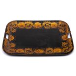 A 19th century toleware tray: of rectangular outline with gilded foliate decorated border,