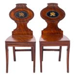 A pair of Regency mahogany hall chairs:,