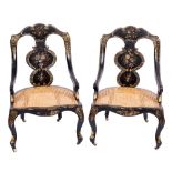 A pair of Victorian black lacquer and decorated occasional chairs:,