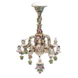 A German porcelain six-branch chandelier in the Meissen manner: applied and moulded with cherubs,