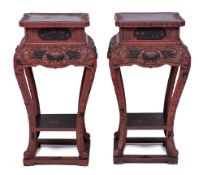 A pair of Chinese carved and red and black lacquered wood vase stands, early 20th century,