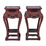 A pair of Chinese carved and red and black lacquered wood vase stands, early 20th century,