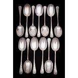 A set of thirteen Victorian silver Hanoverian pattern dessert spoons,