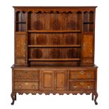 An early 19th Century oak, crossbanded and inlaid dresser:,