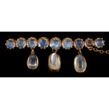 A moonstone brooch,: set with a row of circular cabochon moonstones, in claw settings,