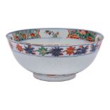 A Chinese verte-imari and incised bowl: the interior painted with a medallion of a jardiniere of