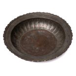 A 19th century Persian bronze bowl: of circular outline,