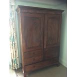A gentleman's 19th Century mahogany wardrobe:, with a moulded dentil cornice,
