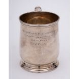 A George V silver mug, maker Fowler & Polglaze, London, 1924: inscribed, of cylindrical outline,