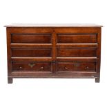 An 18th Century oak dower chest:, with a rectangular hinged moulded top,