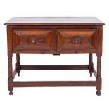 A 17th Century oak rectangular side table:, the top with a moulded edge and re-entrant corners,