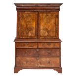 A George II walnut and feather banded cabinet on chest, second quarter 18th century,