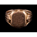 A 9 carat gold signet ring,: the panel engraved with a monogram,