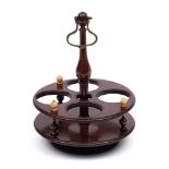 A 19th century treen condiment stand: of circular outline,