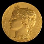 A 19th century French Exposition Universelle Internationale gold prize medal by J.C.
