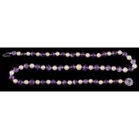 A pearl and amethyst bead necklace: the alternating 7mm cultured pearls and amethyst beads,