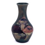 A small William Moorcroft 'Claremont' bottle vase: tube-lined and decorated with a continuous