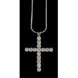 A diamond cross pendant,: set with brilliant cut diamonds, approximately 3.