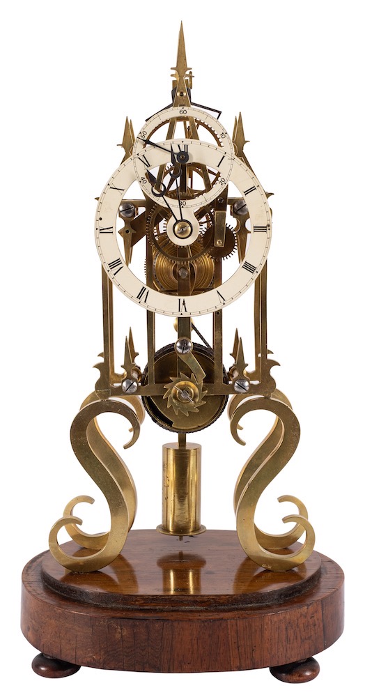 A brass skeleton clock with subsidiary seconds dial: the eight-day duration single chain-fusee