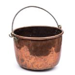 A large 19th century copper cauldron: of plain circular form with steel loop carrying handle,