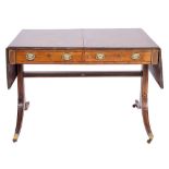 A Regency mahogany and inlaid sofa table:, bordered with ebony lines,