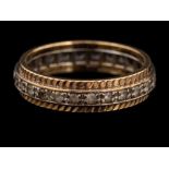 A 9 carat gold and diamond ring,: the band set with circular cut white stones,
