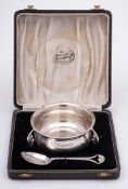 A George VI silver christening bowl and spoon, maker Lanson Ltd, Birmingham, 1946/47: inscribed,