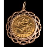A half sovereign pendant,: the half sovereign, 1910, in a pendant mount,