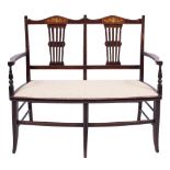 An Edwarian stained beech and inlaid three piece chair back salon suite,