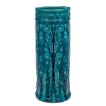 A Bretby turquoise glazed pottery stick stand: moulded overall with eagle heads and scrollwork,