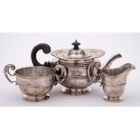 A Victorian silver three-piece tea service, maker Goldsmiths & Silversmiths Co, London,