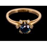 An 18 carat gold sapphire and diamond ring,