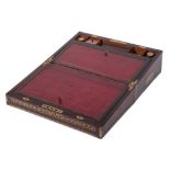 A Victorian rosewood and brass inlaid writing slope: the hinged lid enclosing a tooled leather