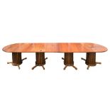A large teak dining table constructed from the deck timber of HMY Britannia:,