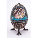 A late 20th century silver gilt and champlevé enamel Easter egg in the Imperial Russian style: