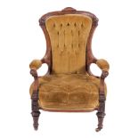 A Victorian carved walnut and button upholstered armchair in Aesthetic Movement taste, circa 1880,