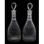 A pair of late 18th century cut glass decanters and stoppers: each with lozenge stopper and triple