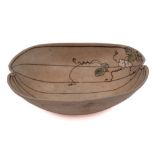 A Japanese earthenware 'gourd' bowl: decorated with a flowering leafy stem and veining,