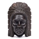 A carved wood mask depicting the native North American Shawnee chief Techmseh: 34cm. high.