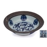 A Chinese blue and white bowl: with flared pewter-mounted rim,