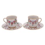 A pair of William Moorcroft Macintyre Florian ware cups and saucers: decorated in the 'Eighteenth