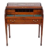 An early 19th Century mahogany and inlaid cylinder tambour-fronted writing desk:,