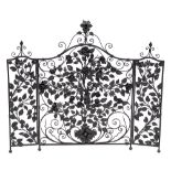 A painted wrought iron three fold firescreen, 20th century,