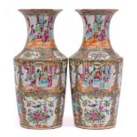 A pair of Chinese Canton famille rose vases: with waisted necks and flared rims,
