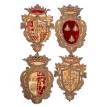 A set of four raised-work embroidered armorials: of oval and shield shaped outlines surmounted with