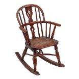 A yew wood and elm child's Windsor rocking chair, second quarter 19th century and later adapted,
