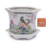 A Chinese famille rose jardiniere and stand: of flared hexagonal form,